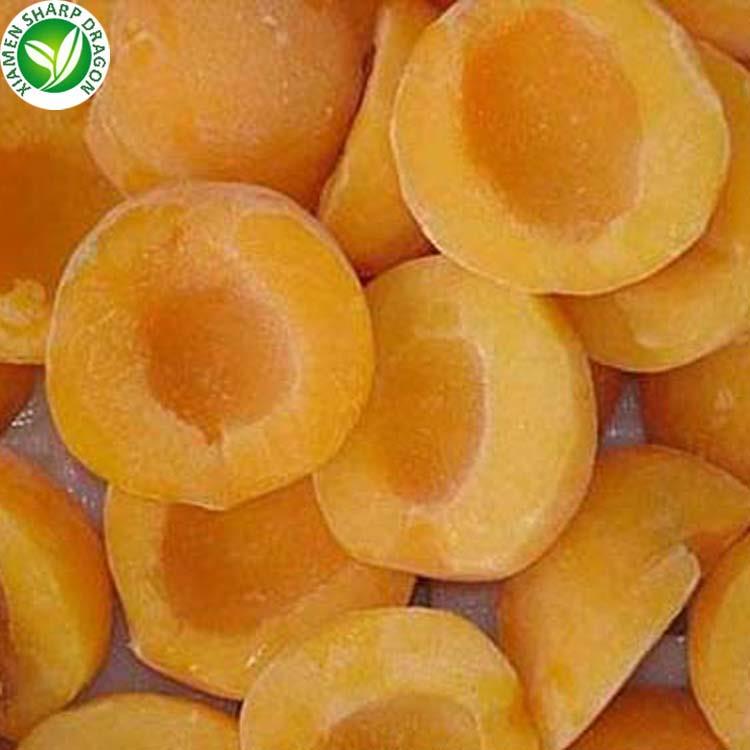 Frozen yellow peach halves with visible frost on the cut surfaces